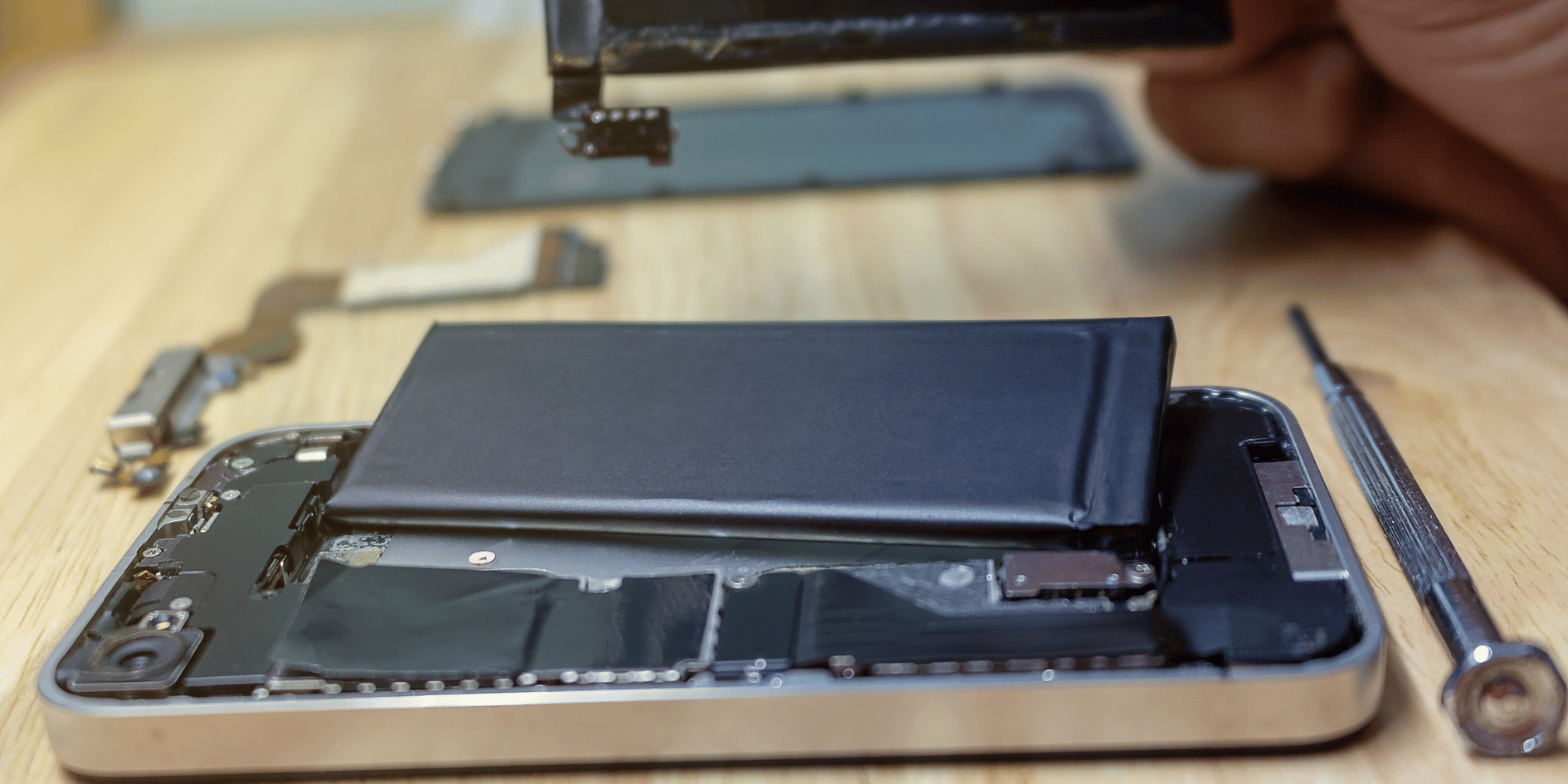 iPhone with a dangerously low battery warning, signaling urgent replacement need